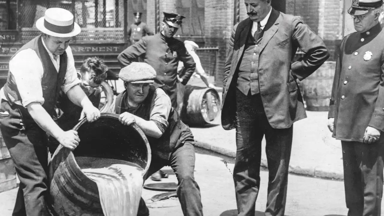 The New York City police dispose of illegal liquor after a raid in 1921. 